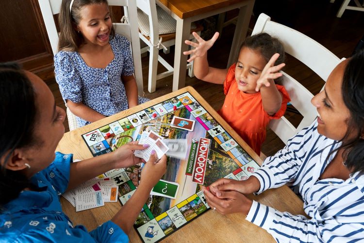 Family playing Monopoly 