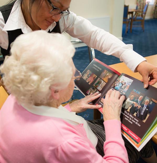 Waiting staff at Colten Care's Woodpeckers home assisting resident