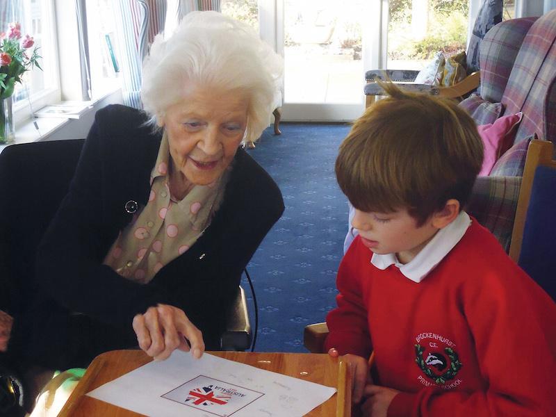 Woodpeckers resident Yvonne Carnegie with a young visitor
