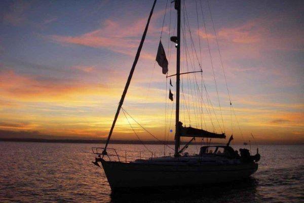 Yacht with sunset behind