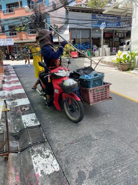 Lady on tricycle in Thailand