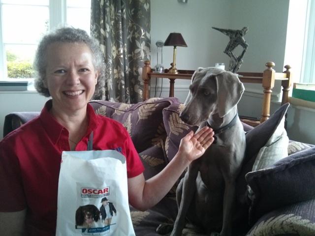 Clare Muir local distributor for Oscar Pet Foods with a customer's pet