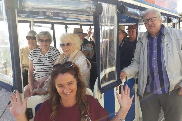 People in and beside bus